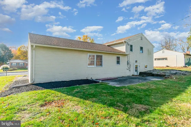 a view of a backyard with a garden and plants