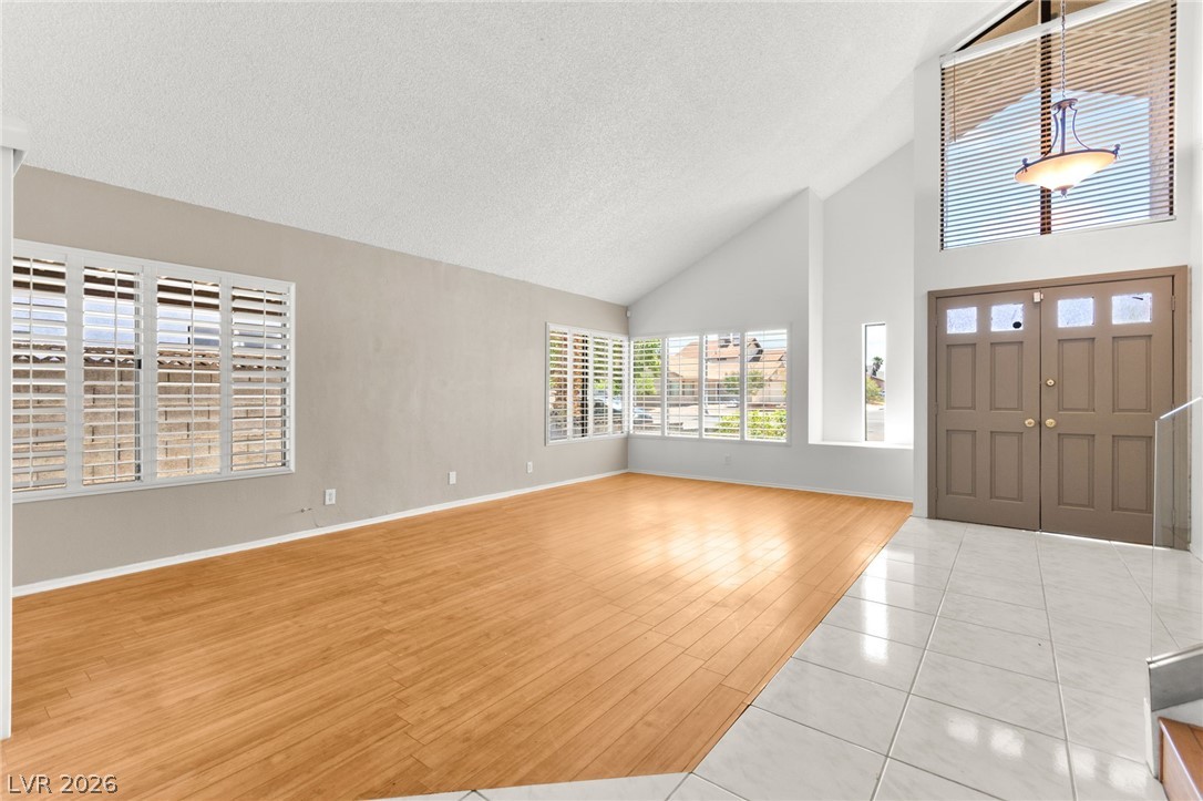 4430 Cranbrook Way Las Vegas, NV 89103 - Photo 6 of 50 Lofty ceilings complement a spacious living area, ideal for relaxation and entertaining.
