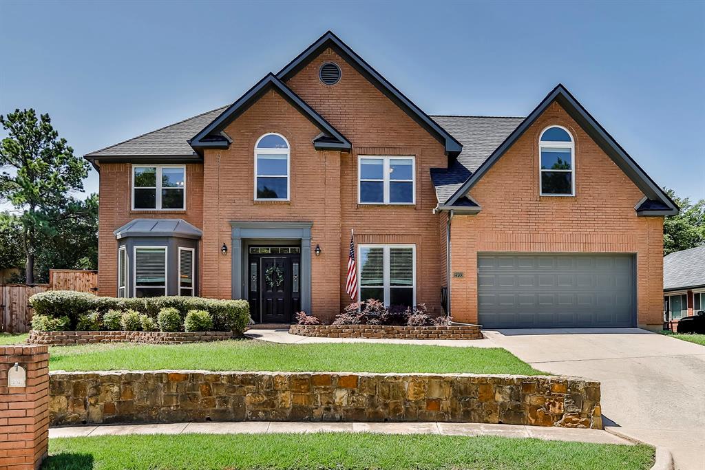 2703 Whitby Lane Grapevine, TX 76051 - Photo 1 of 1 a front view of a house with a yard and garage