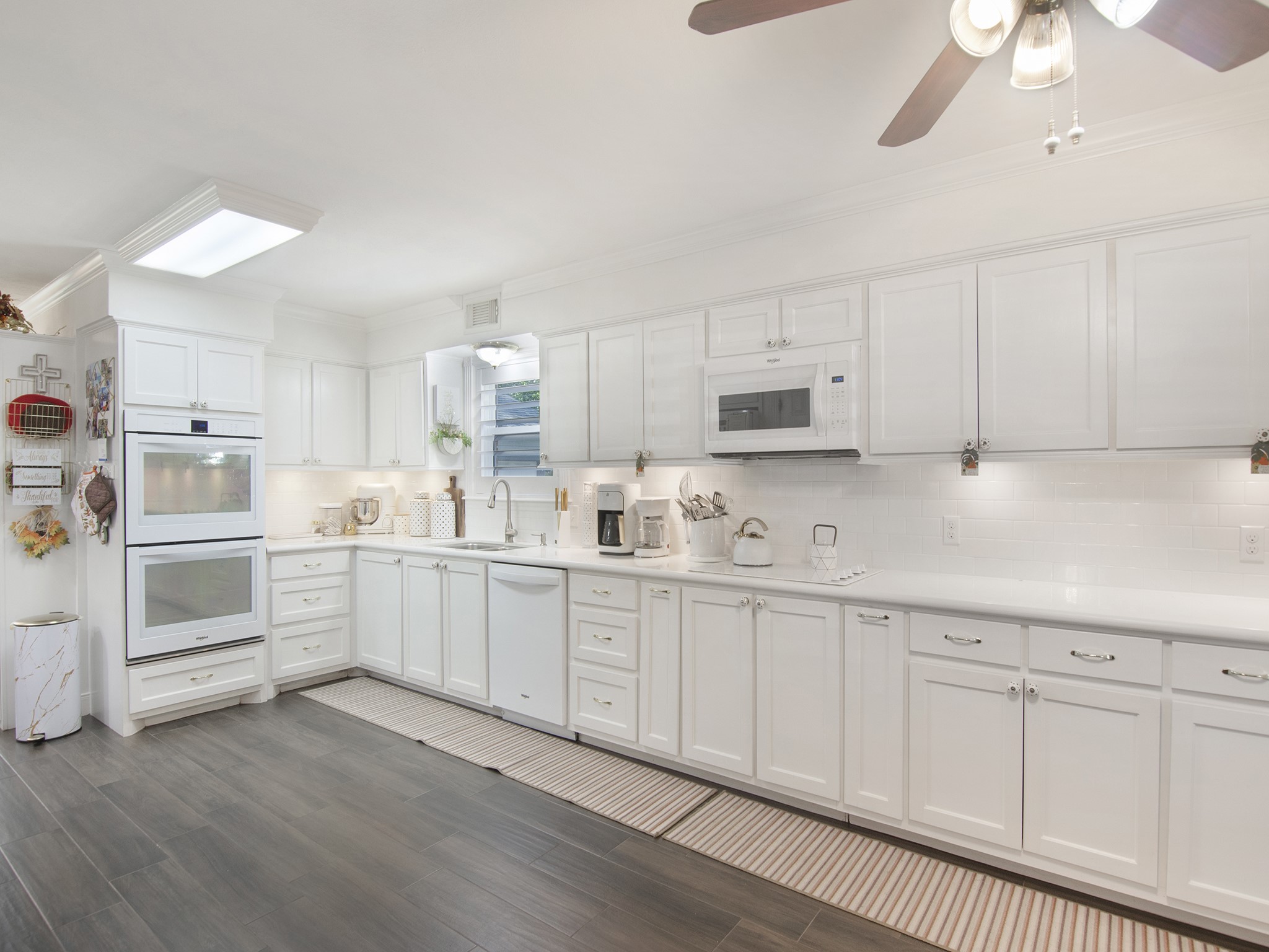 532 Raleigh Drive Conroe, TX 77302 - Photo 14 of 40 This bright and airy kitchen is the true heart of the home. Gleaming white cabinetry and double ovens provide both style and practicality while ample storage keeps everything organized and within reach.