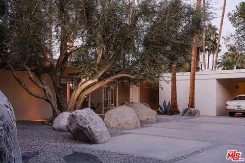 a view of a car parked in front of house