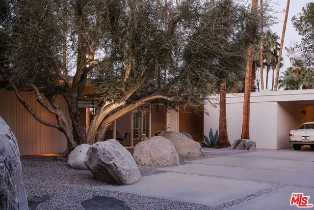 a view of a car parked in front of house