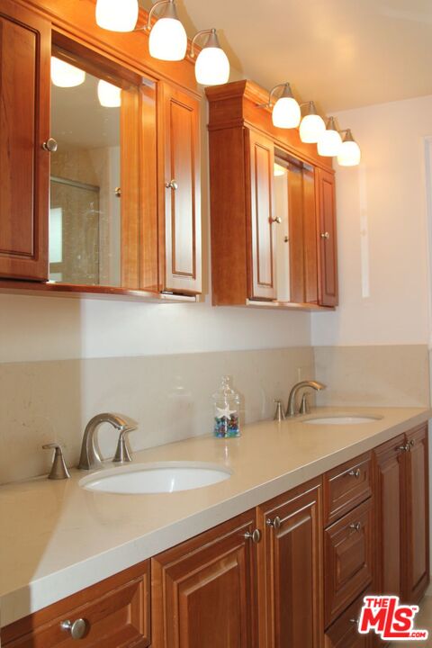 3641 Surfwood Road Malibu, CA 90265 - Photo 15 of 29 a bathroom with a sink and a mirror