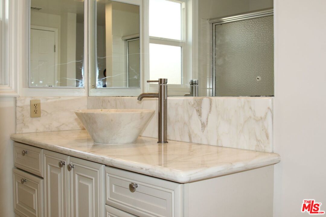 3641 Surfwood Road Malibu, CA 90265 - Photo 17 of 29 a bathroom with a sink and a mirror