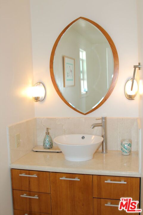 3641 Surfwood Road Malibu, CA 90265 - Photo 18 of 29 a bathroom with a sink and a mirror
