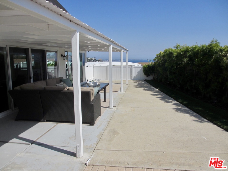 3641 Surfwood Road Malibu, CA 90265 - Photo 21 of 29 a view of a patio with chairs and plants