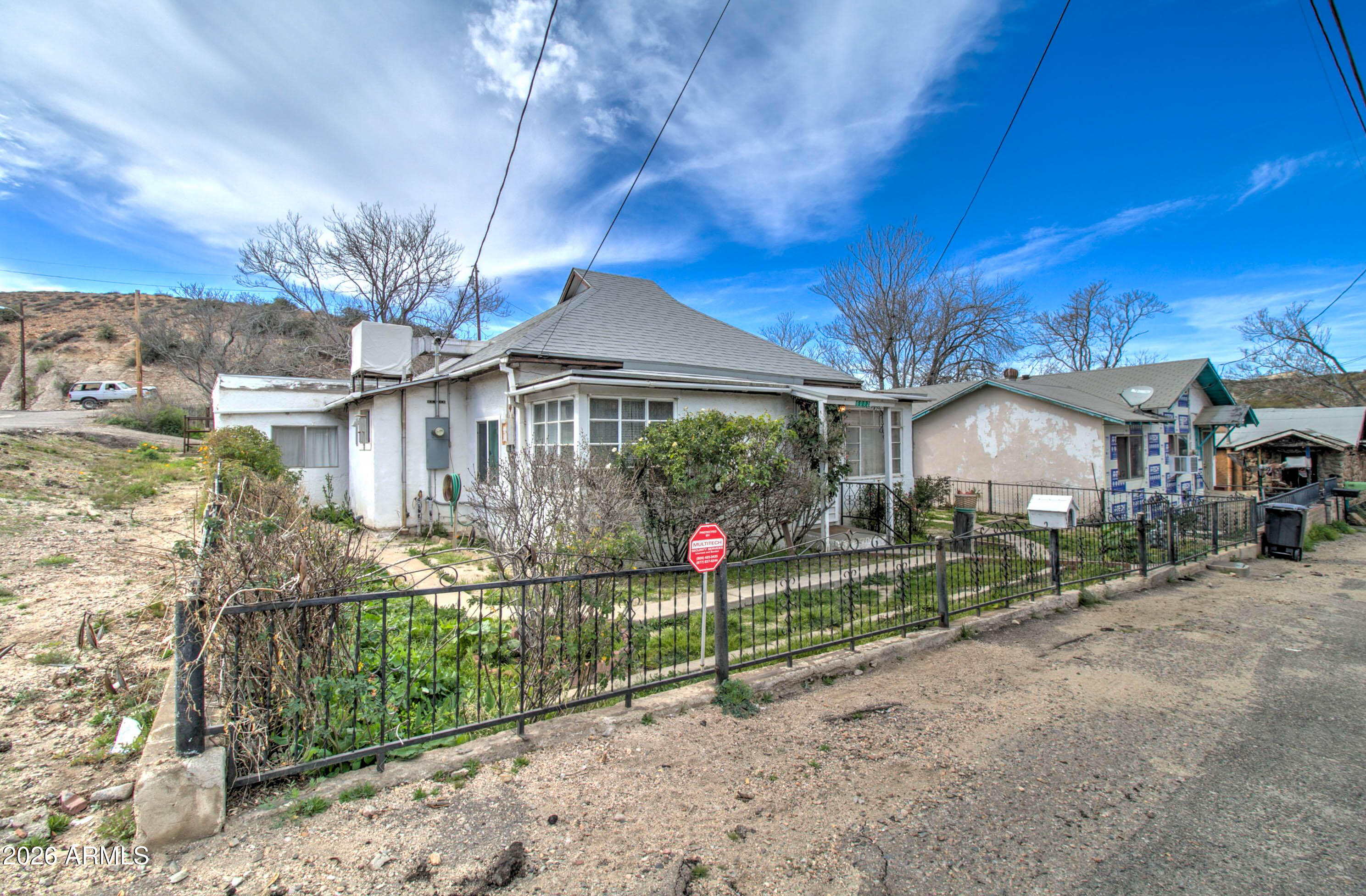 6002 Marion Canyon Street Claypool, AZ 85532 - Photo 1 of 45 a front view of a house with fountain and porch