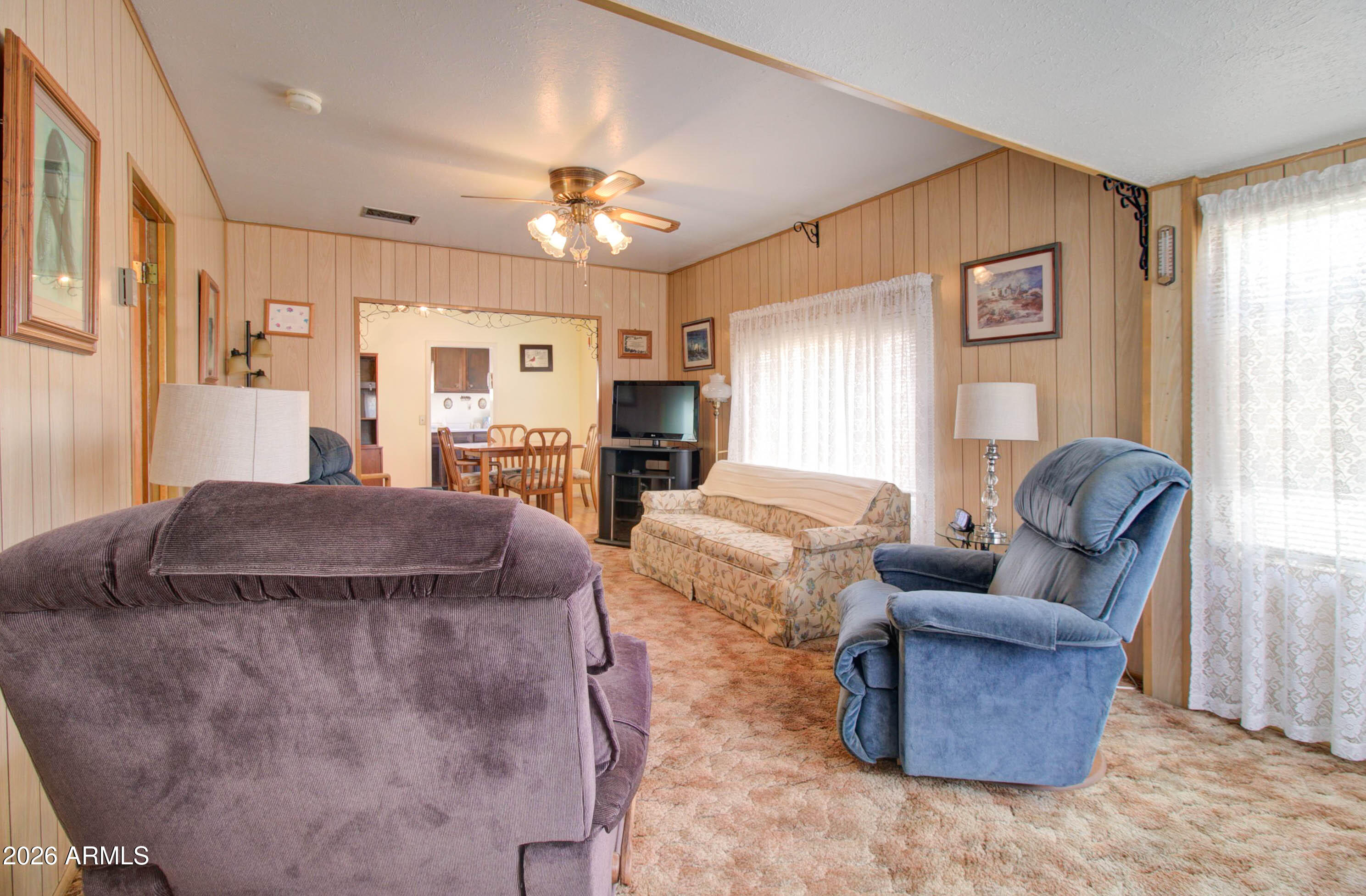 6002 Marion Canyon Street Claypool, AZ 85532 - Photo 16 of 45 a living room with furniture and a fireplace