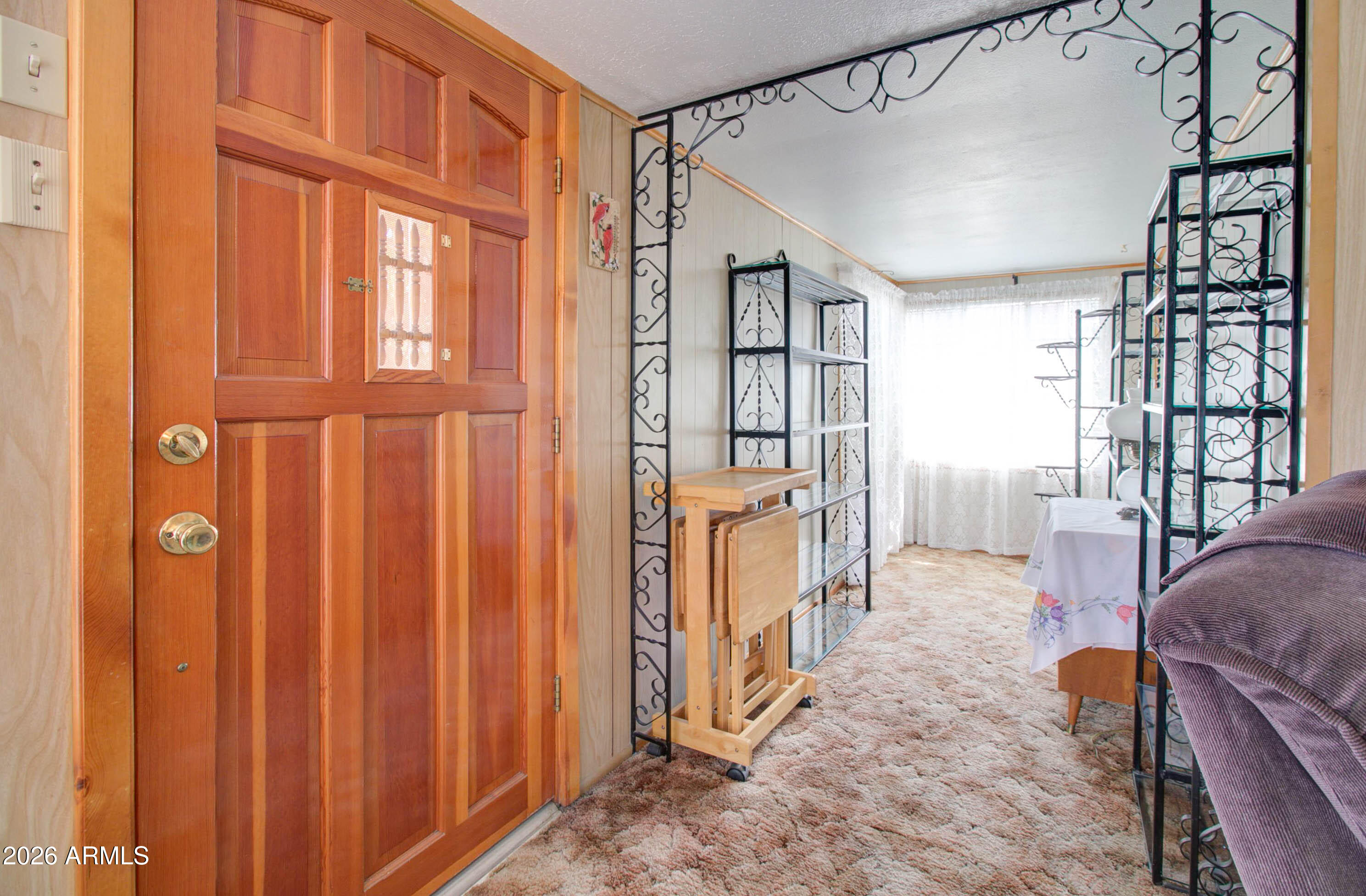 6002 Marion Canyon Street Claypool, AZ 85532 - Photo 18 of 45 a living room with furniture a window and a flat screen tv