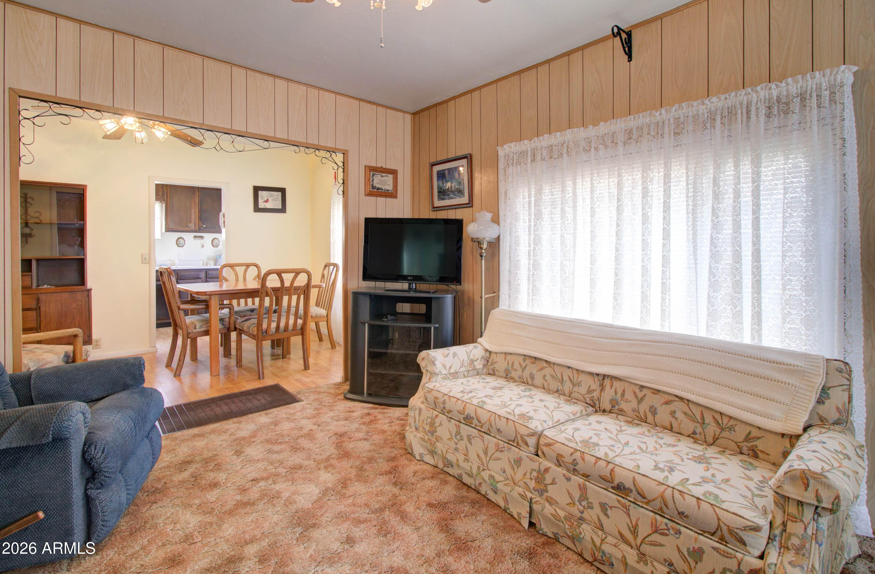 6002 Marion Canyon Street Claypool, AZ 85532 - Photo 19 of 45 a living room with furniture and a flat screen tv