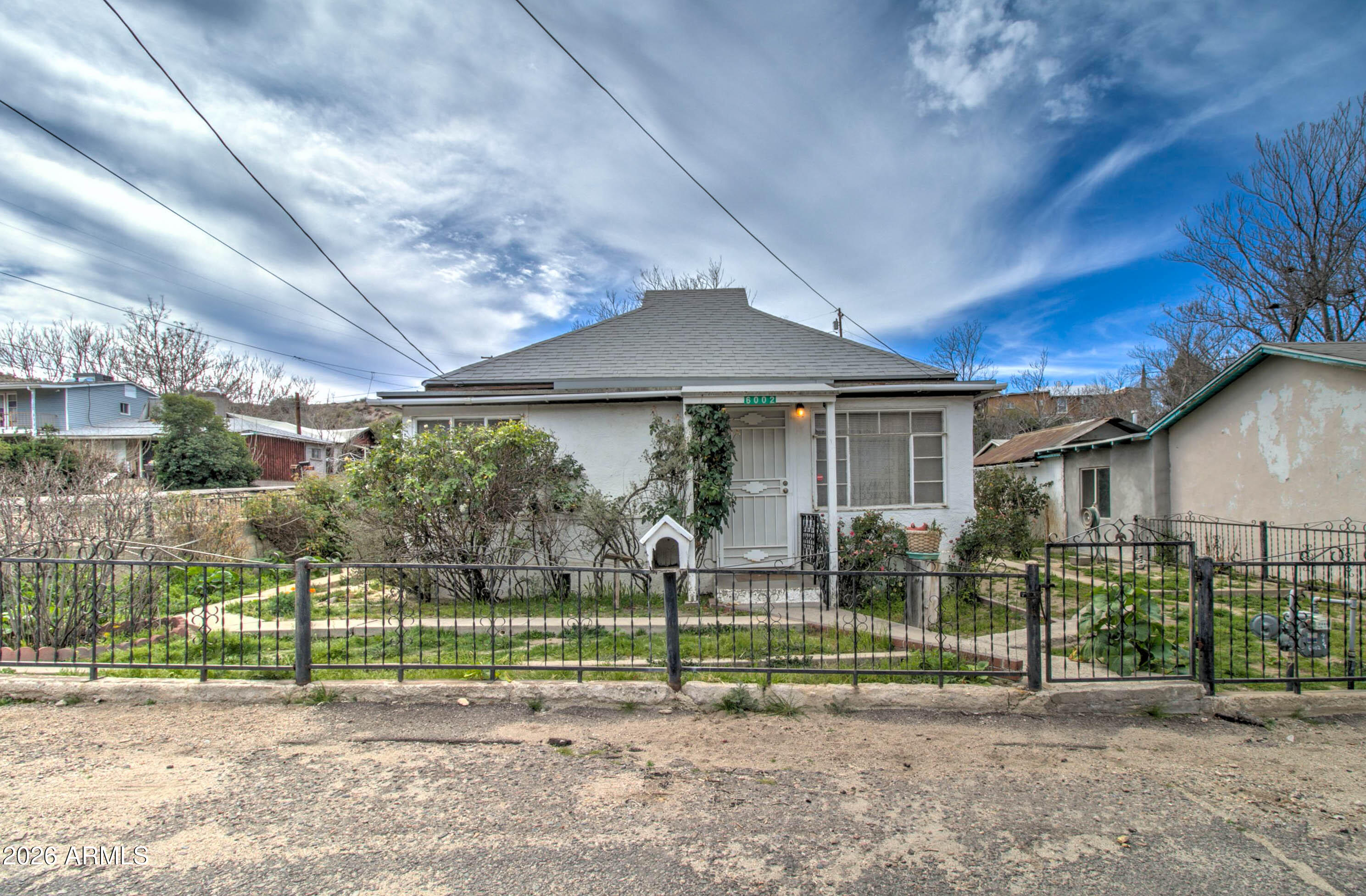 6002 Marion Canyon Street Claypool, AZ 85532 - Photo 2 of 45 a view of a yard in front of a house