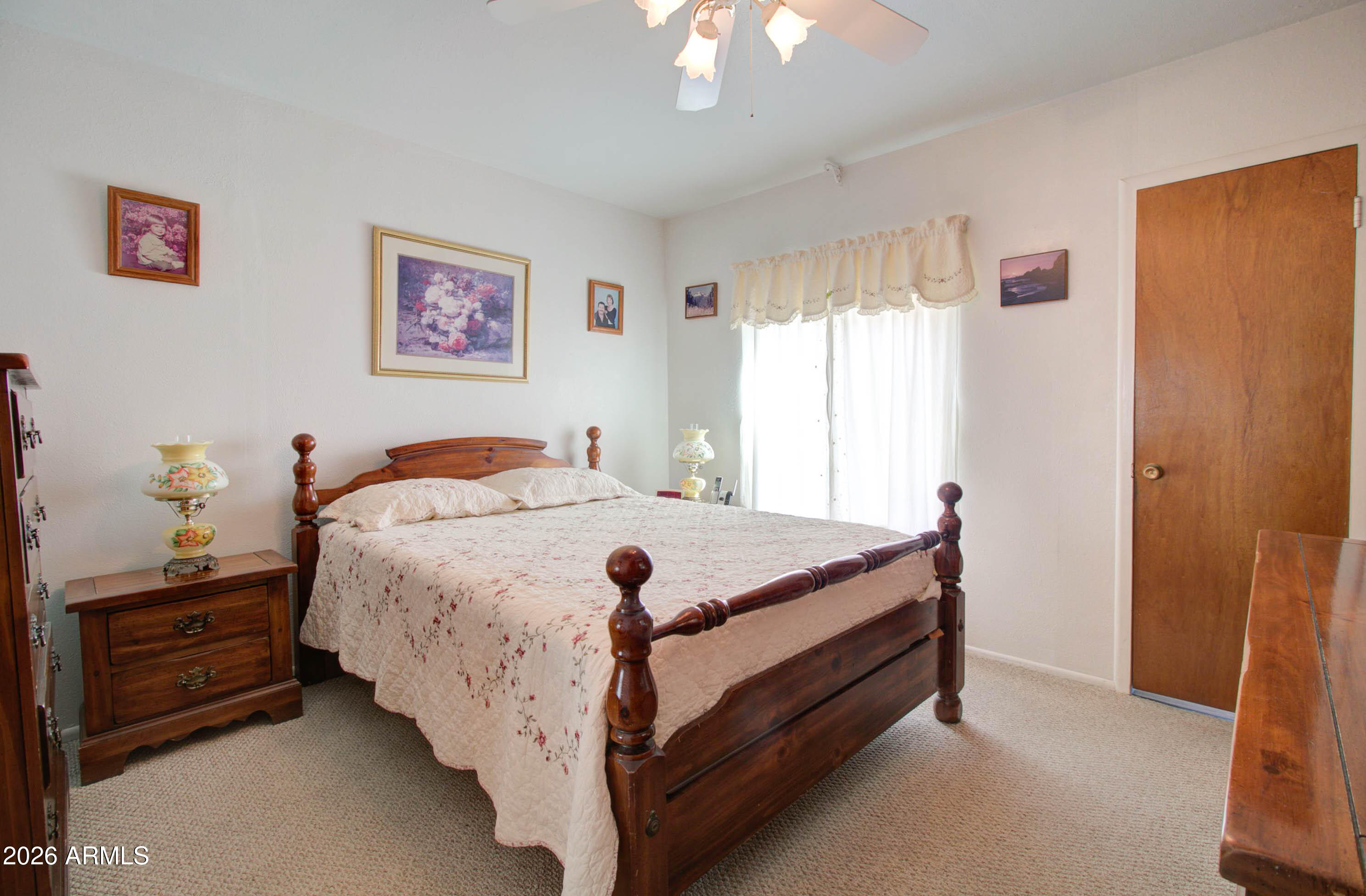 6002 Marion Canyon Street Claypool, AZ 85532 - Photo 21 of 45 a bed sitting in a bedroom next to a window