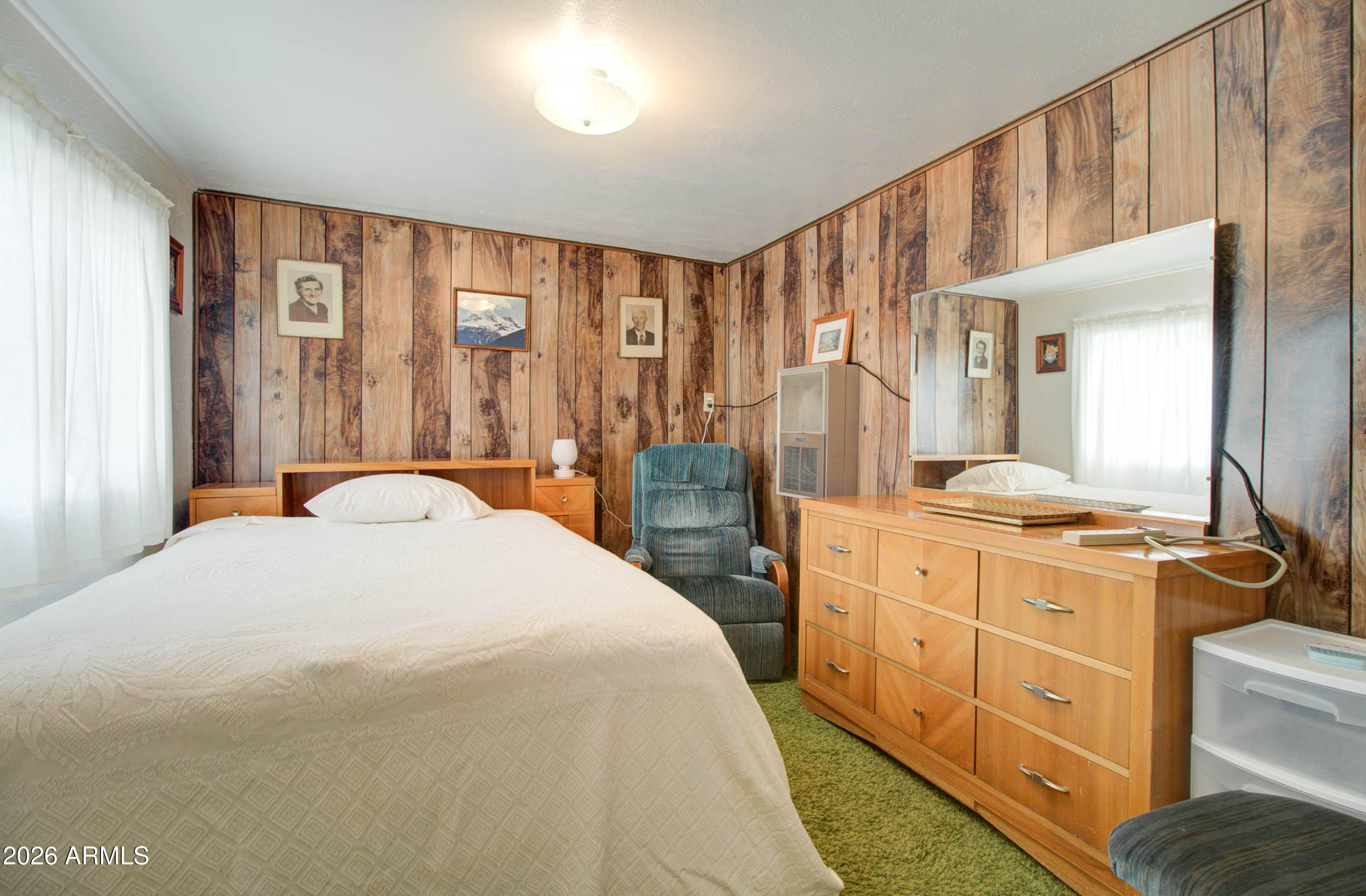 6002 Marion Canyon Street Claypool, AZ 85532 - Photo 33 of 45 a spacious bedroom with a large bed and a dresser