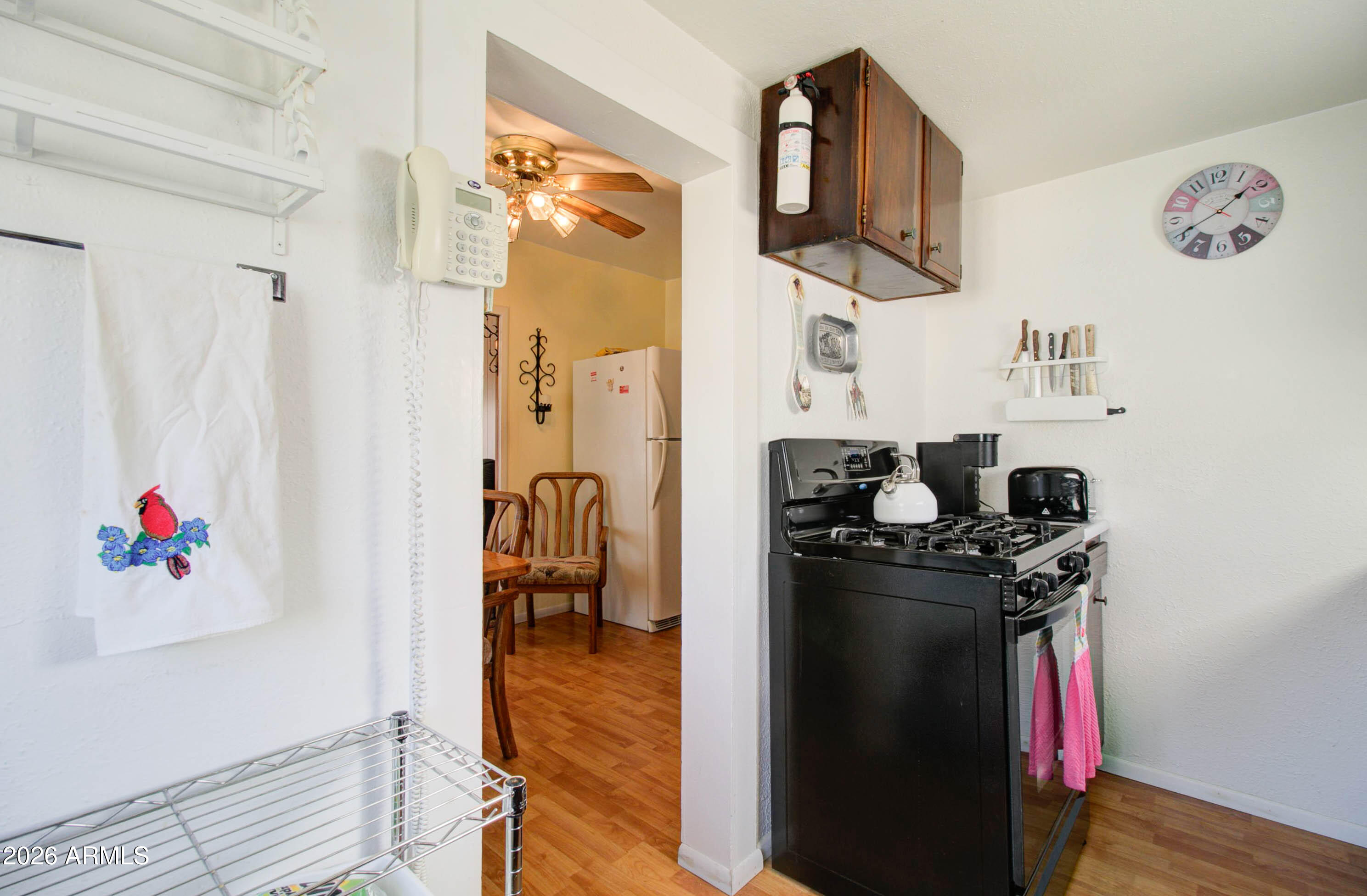 6002 Marion Canyon Street Claypool, AZ 85532 - Photo 35 of 45 a kitchen with a refrigerator and a stove