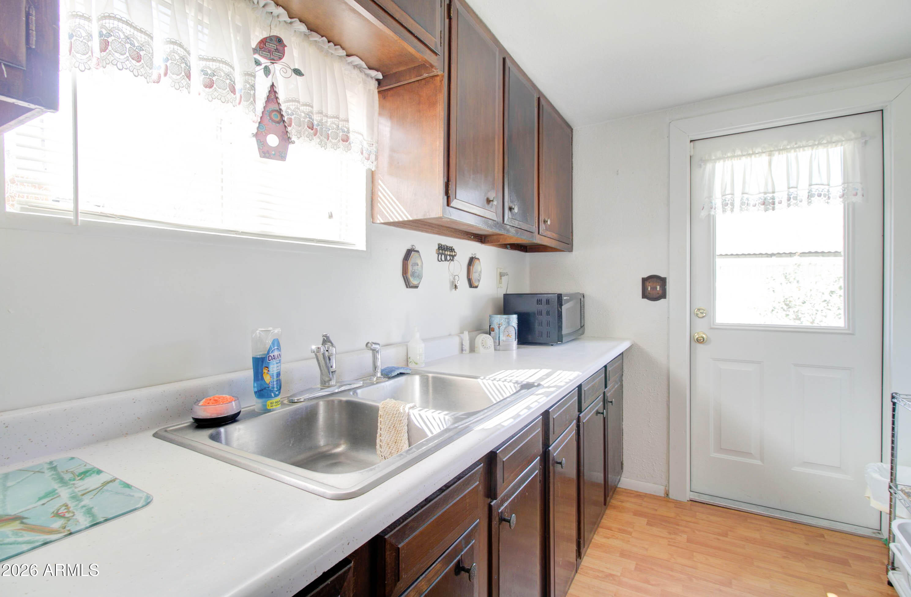 6002 Marion Canyon Street Claypool, AZ 85532 - Photo 37 of 45 a kitchen with stainless steel appliances granite countertop a sink a stove and a refrigerator