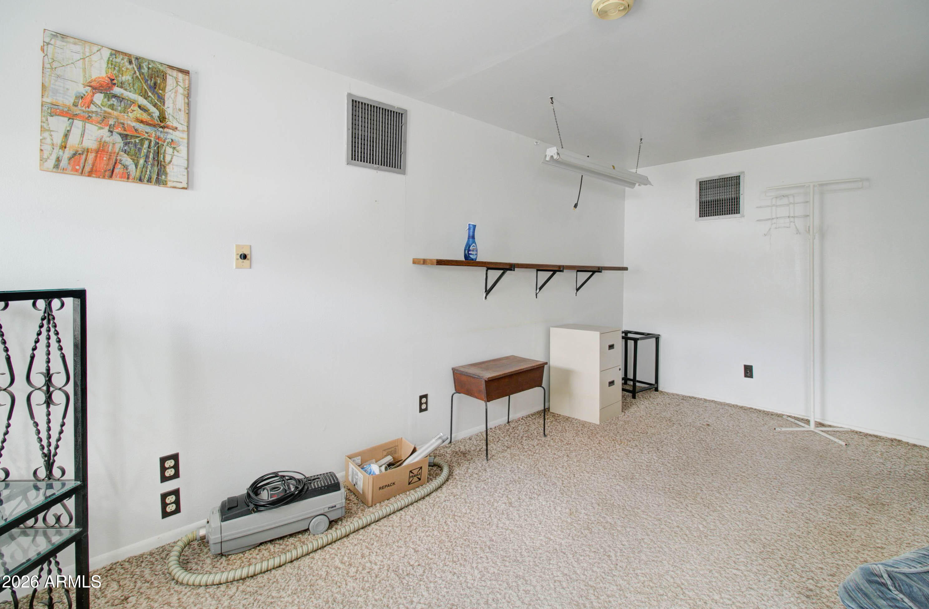 6002 Marion Canyon Street Claypool, AZ 85532 - Photo 39 of 45 a view of room with workspace and wooden floor