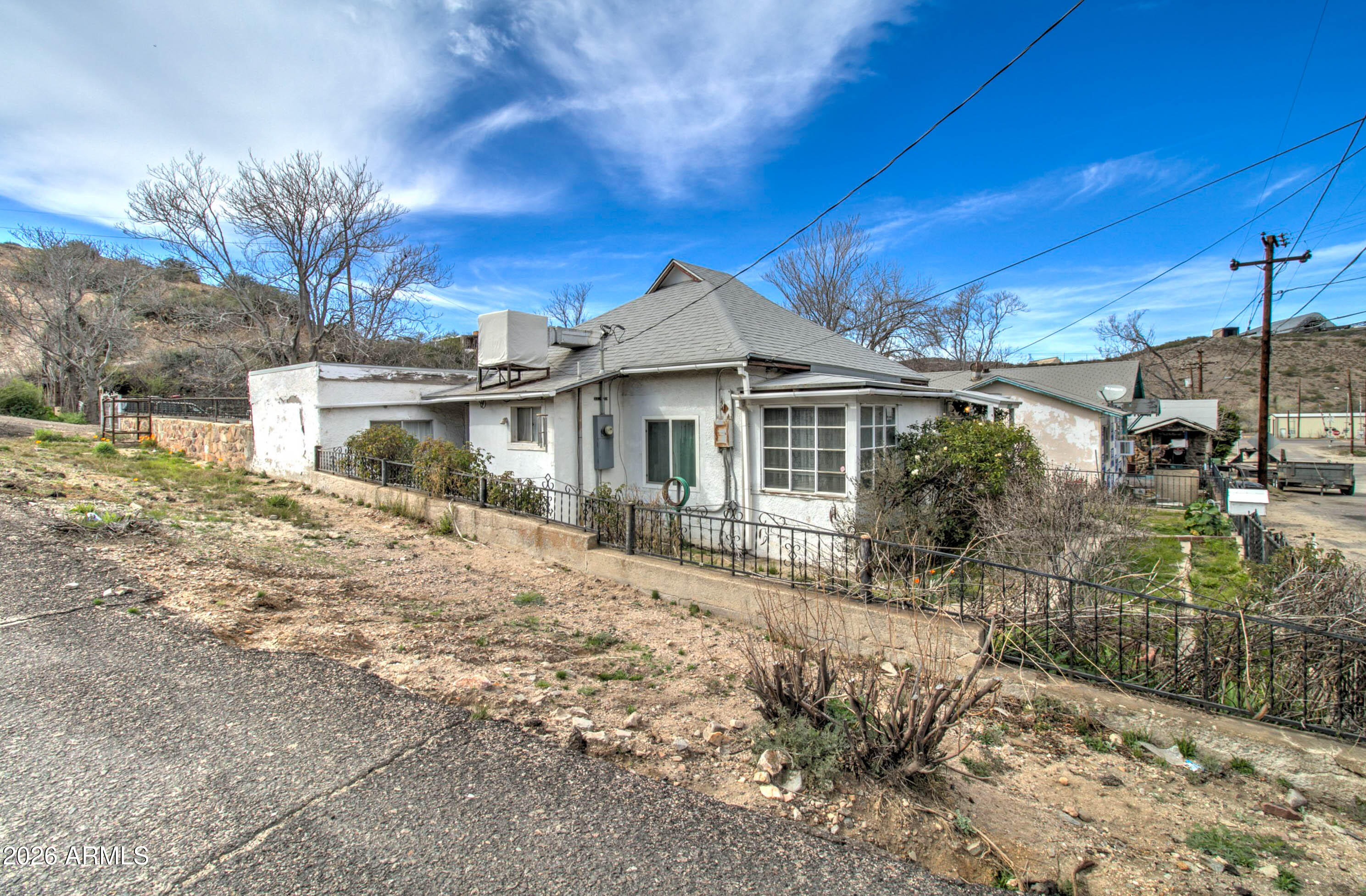6002 Marion Canyon Street Claypool, AZ 85532 - Photo 4 of 45 a front view of a house with a yard