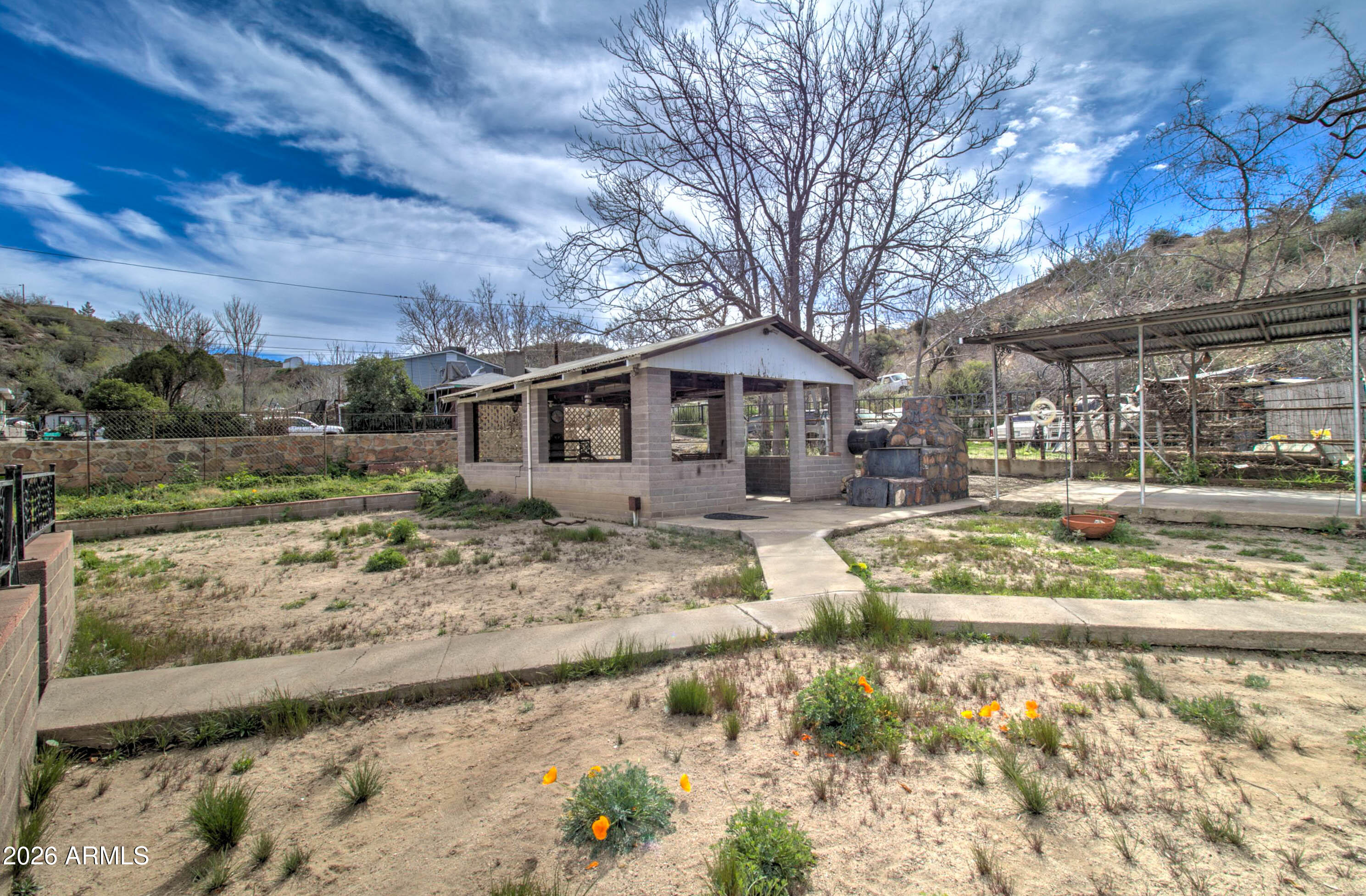 6002 Marion Canyon Street Claypool, AZ 85532 - Photo 8 of 45 a view of a large white house with a yard covered with snow in front of house