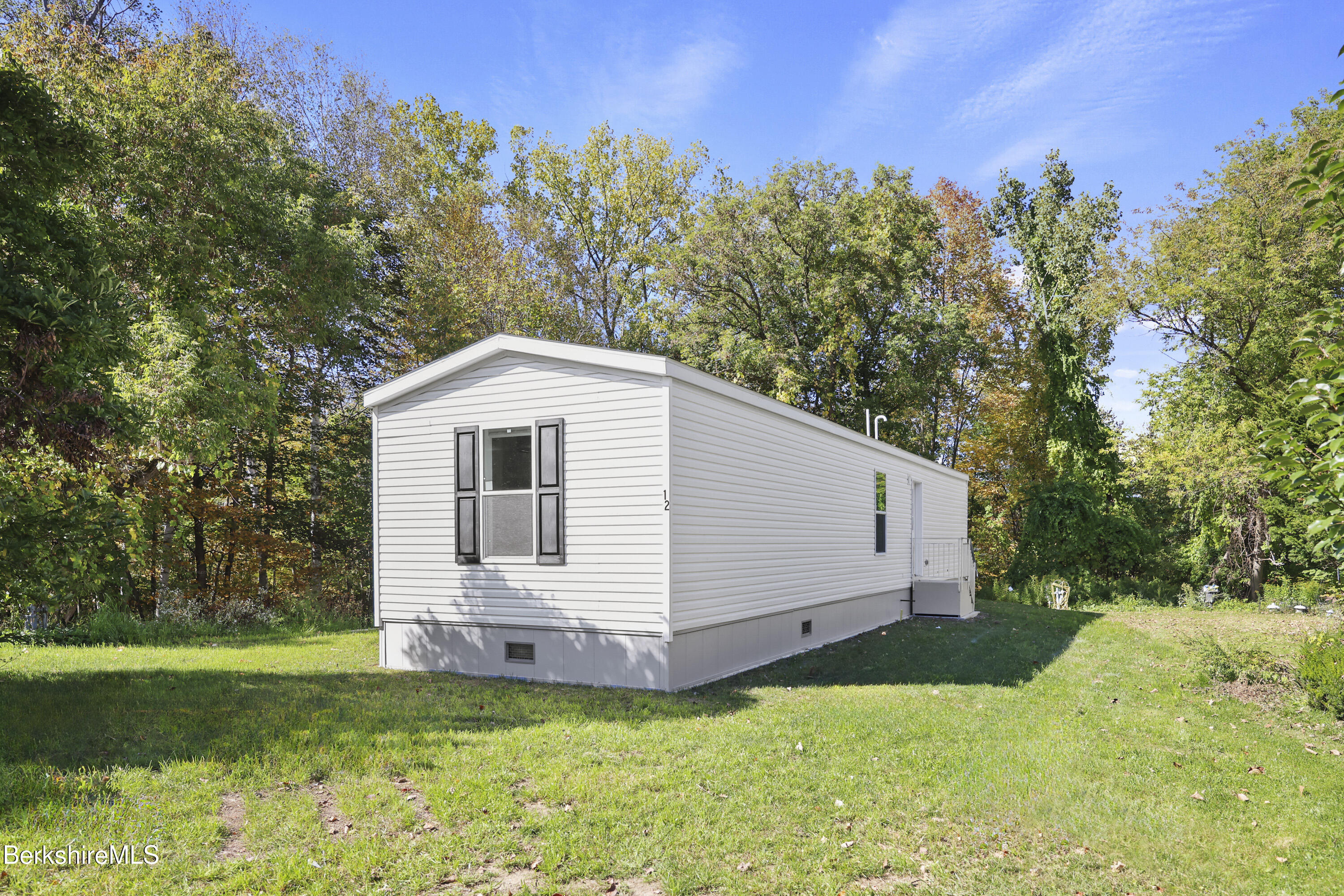 12 Aztec Drive North Adams, MA 01247 - Photo 2 of 14 a view of a backyard with barn and large trees