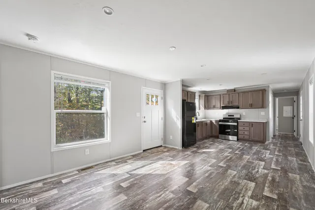 a view of a livingroom with furniture and windows