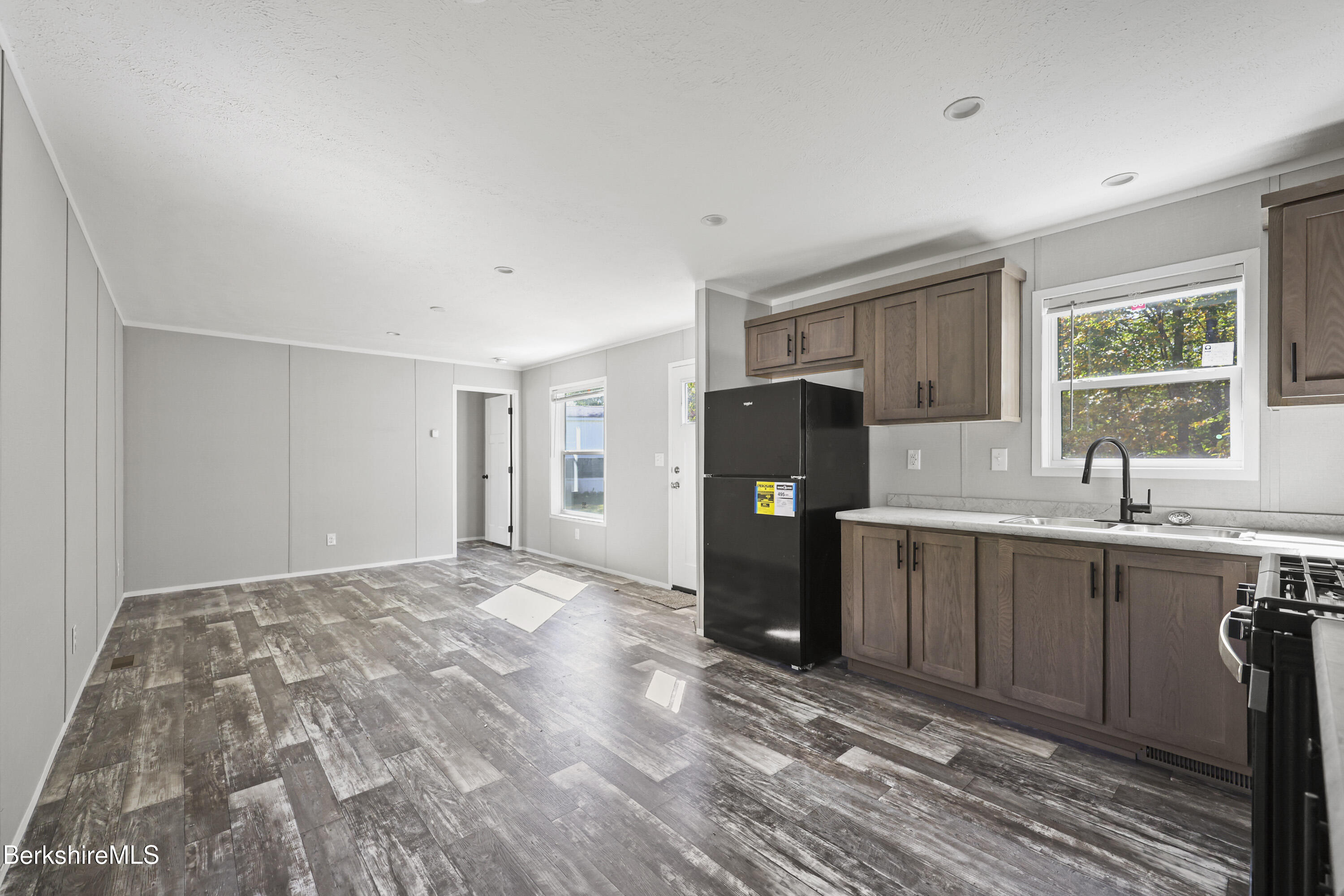 12 Aztec Drive North Adams, MA 01247 - Photo 8 of 14 a kitchen with a refrigerator a sink and a window