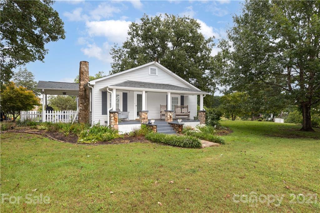 4551 River Road Smyrna, SC 29743 - Photo 1 of 19 a front view of a house with garden