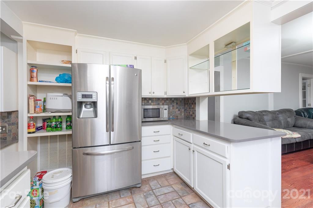 4551 River Road Smyrna, SC 29743 - Photo 7 of 19 a kitchen with stainless steel appliances a refrigerator sink and cabinets