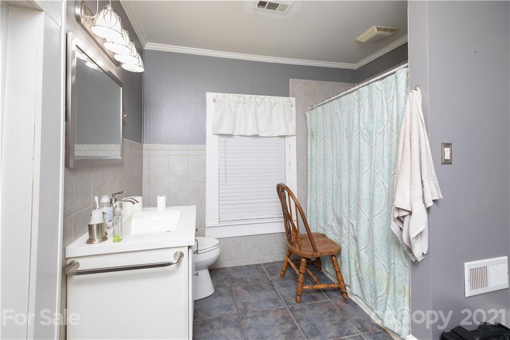 4551 River Road Smyrna, SC 29743 - Photo 10 of 19 a bathroom with a sink and a mirror