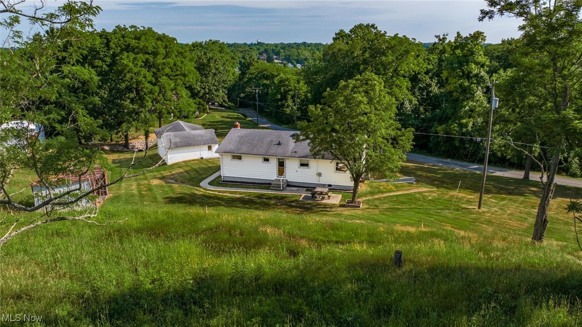 165 Old Rix Mills Road New Concord, OH 43762 - Photo 32 of 34 Aerial view featuring a forest view