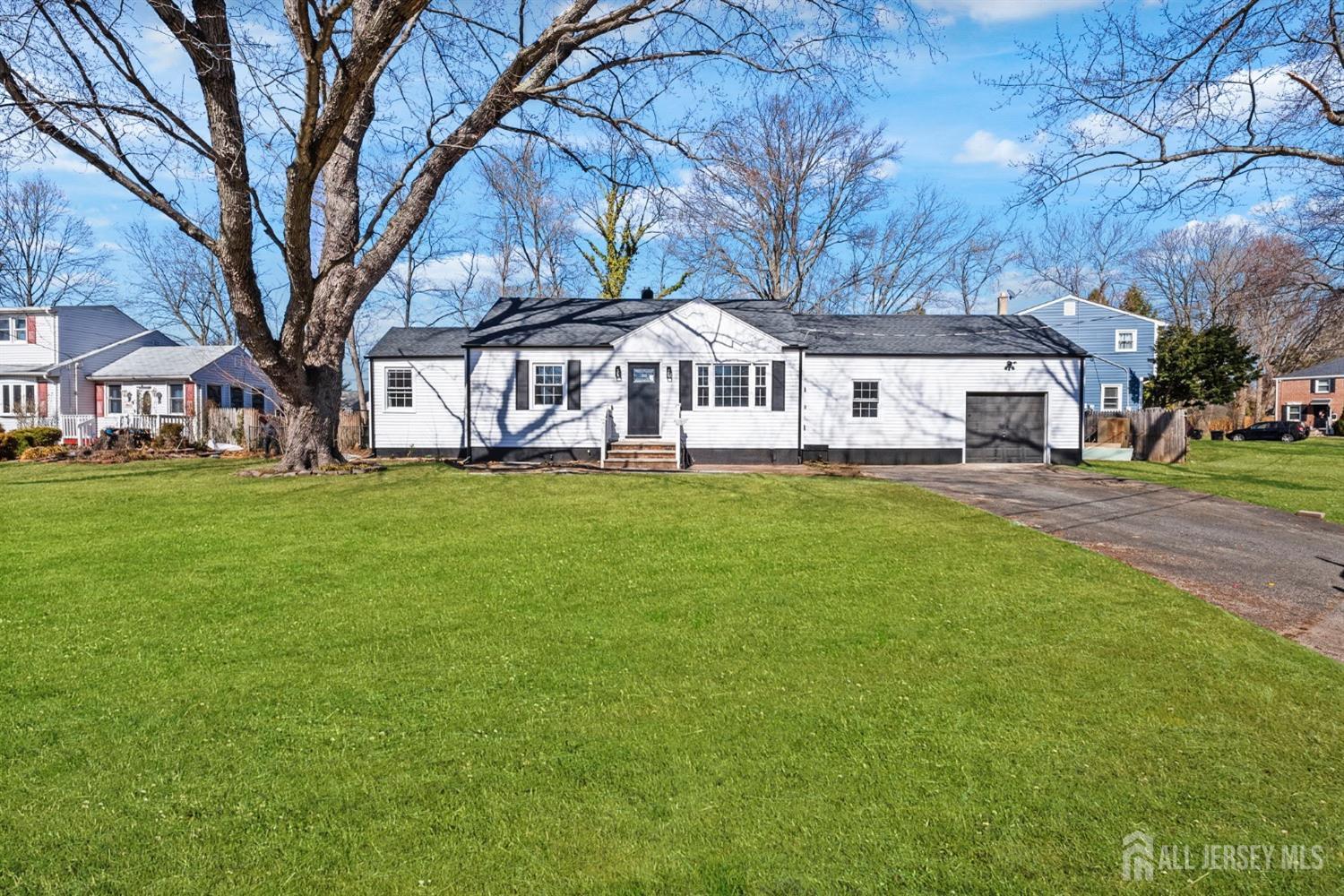 a front view of a building with a yard