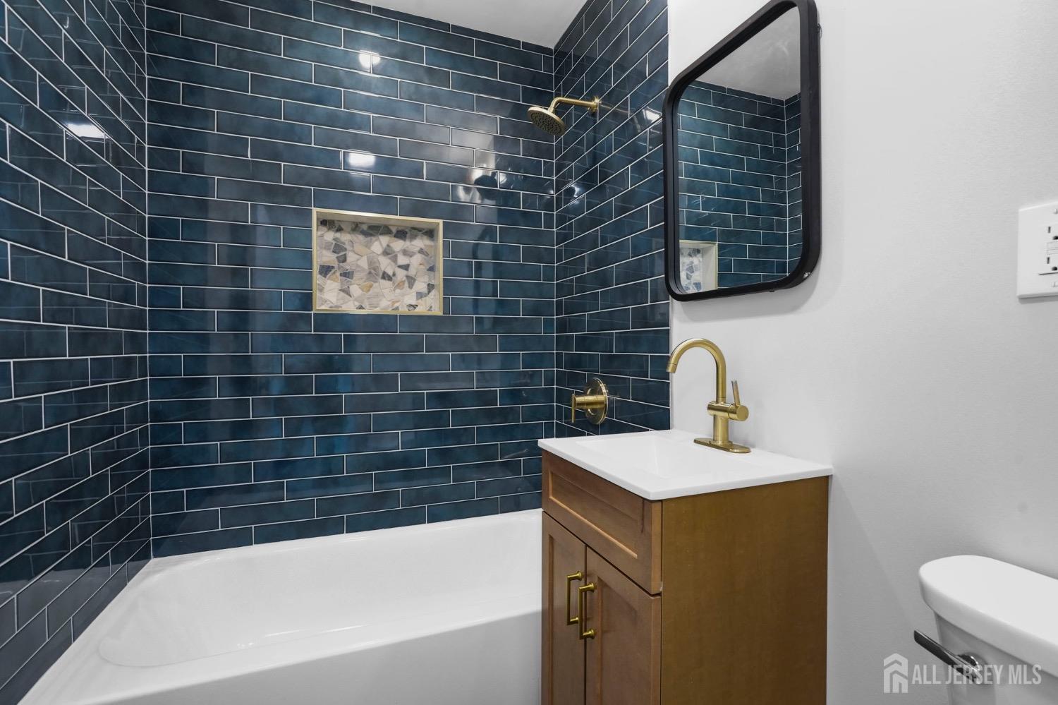 32 Nelson Circle East Brunswick, NJ 08816 - Photo 17 of 35 a bathroom with a sink and a bathtub