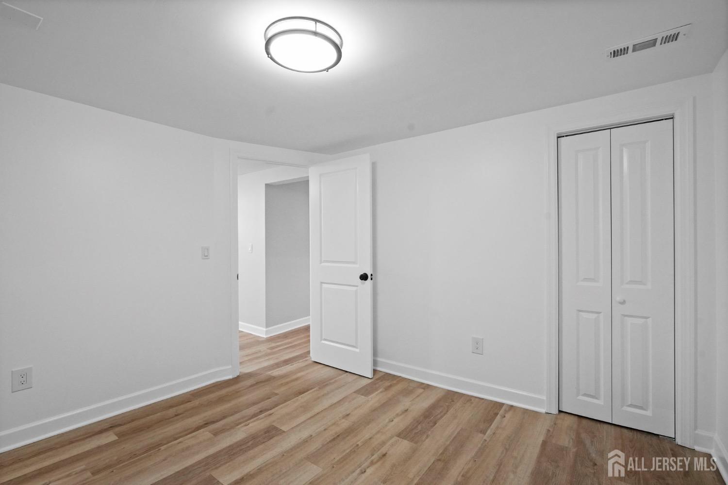 32 Nelson Circle East Brunswick, NJ 08816 - Photo 24 of 35 a view of room with wooden floor