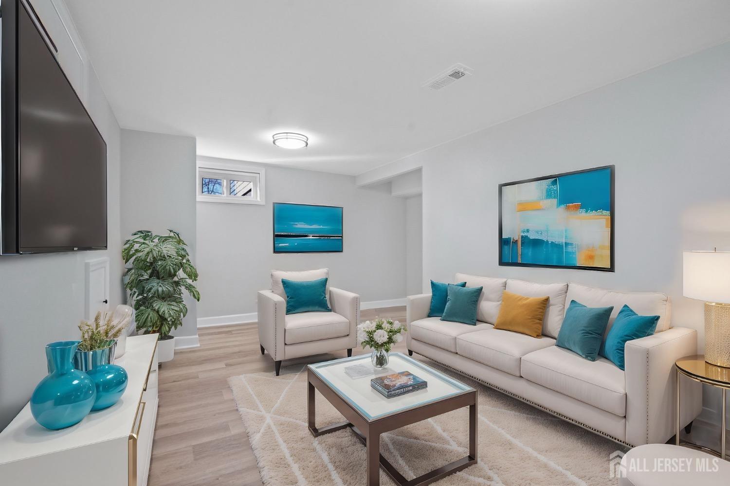 32 Nelson Circle East Brunswick, NJ 08816 - Photo 25 of 35 a living room with furniture and a flat screen tv