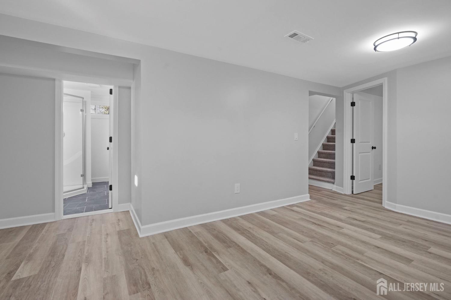 32 Nelson Circle East Brunswick, NJ 08816 - Photo 26 of 35 a view of an empty room with wooden floor