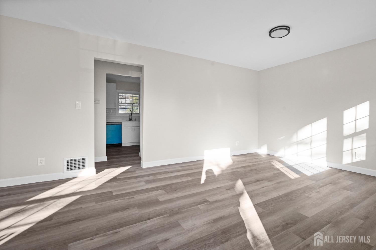 32 Nelson Circle East Brunswick, NJ 08816 - Photo 29 of 35 a view of empty room with wooden floor and fan