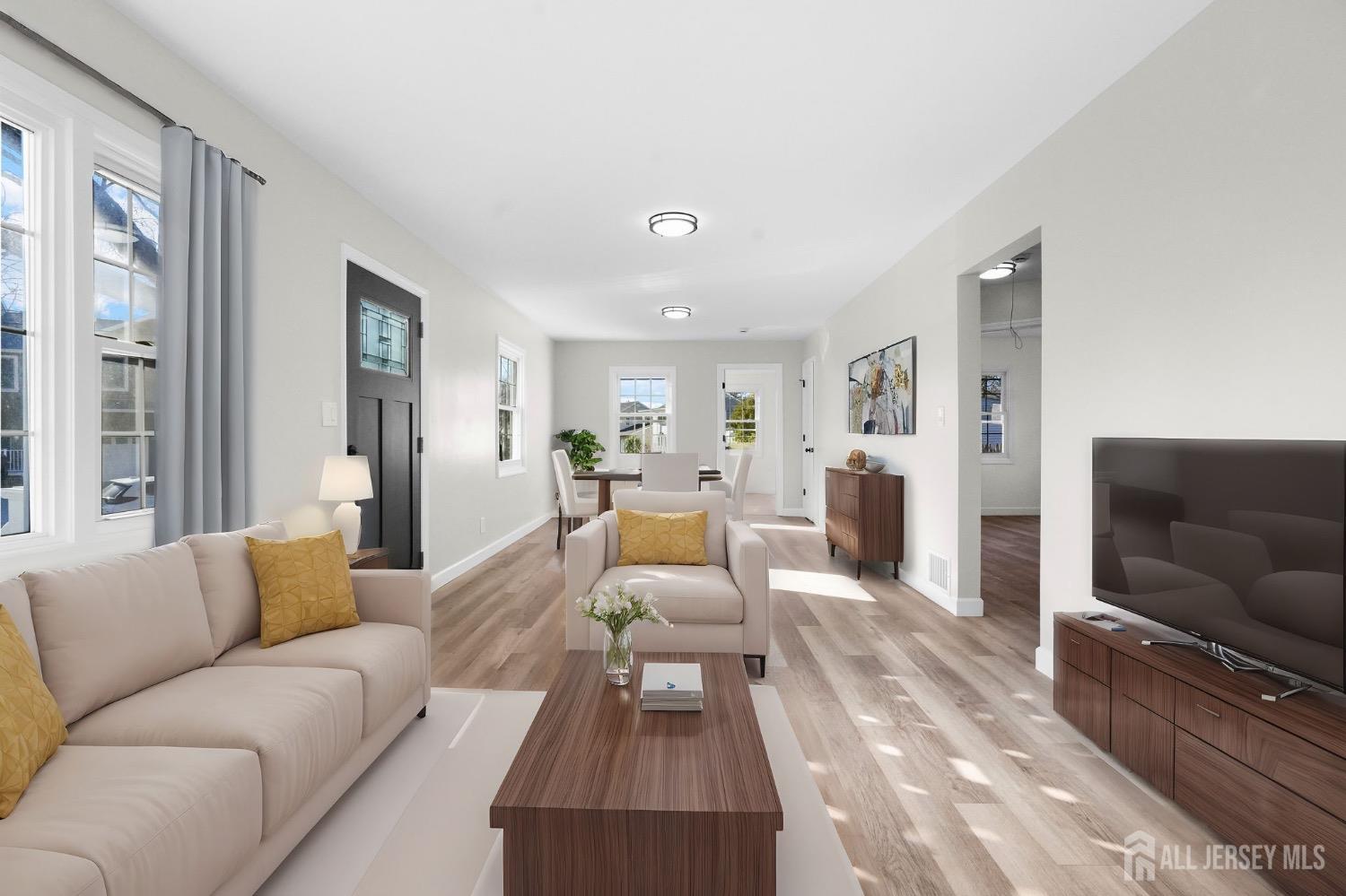 32 Nelson Circle East Brunswick, NJ 08816 - Photo 4 of 35 a living room with furniture and a couch