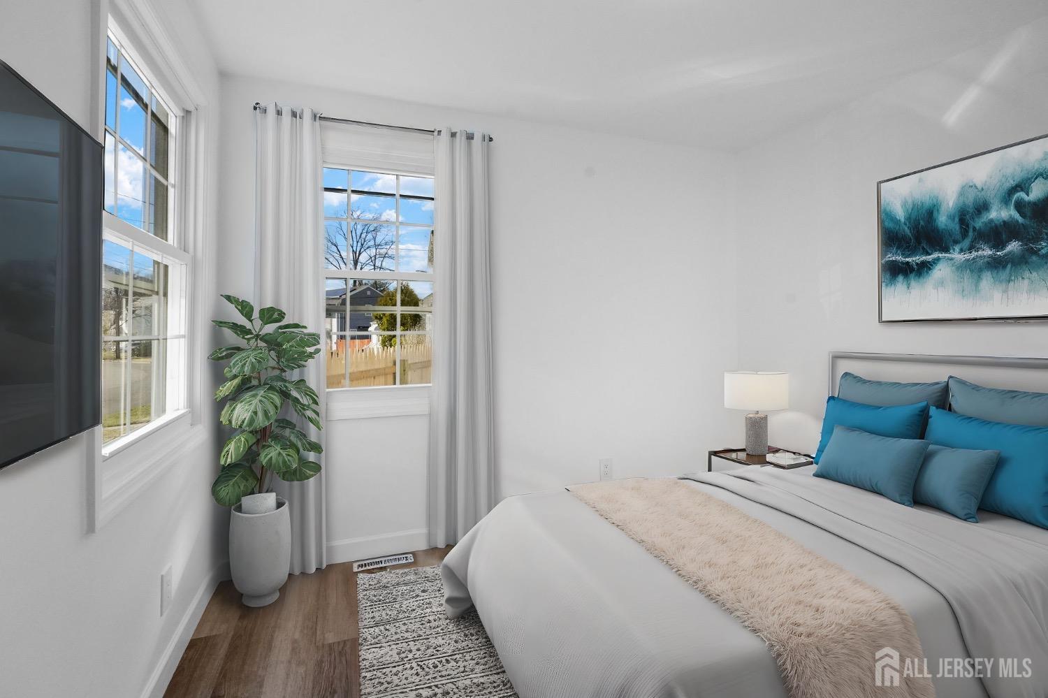 32 Nelson Circle East Brunswick, NJ 08816 - Photo 5 of 35 a bedroom with a bed and a potted plant