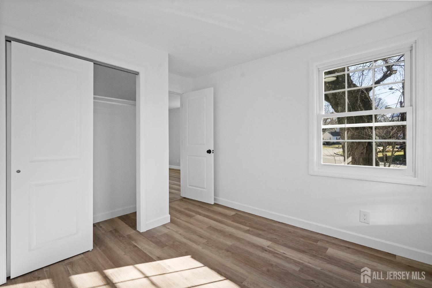 32 Nelson Circle East Brunswick, NJ 08816 - Photo 6 of 35 a view of empty room with a window