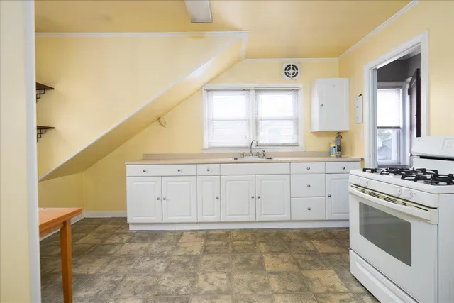 a view of a kitchen with electric appliances