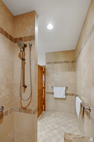 755 South Zion Ridge Drive Orderville, UT 84758 - Photo 38 of 84 Full bath featuring a tile shower, tile walls, recessed lighting, and tile patterned flooring