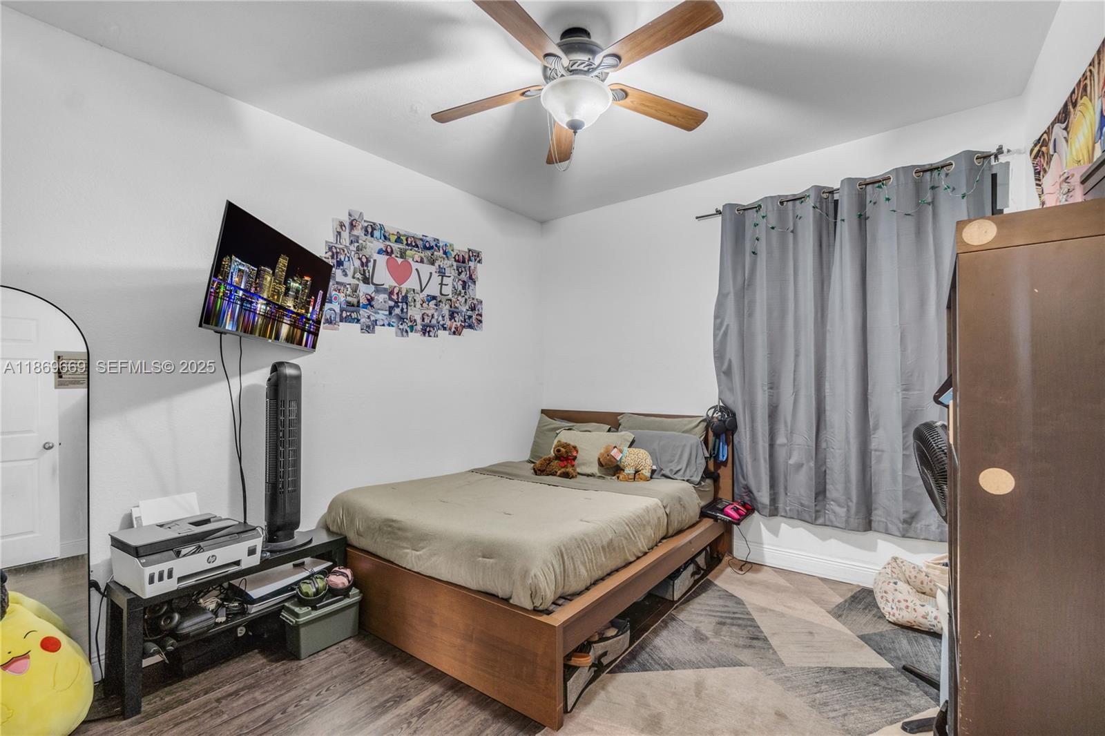 120 Southeast 6th Road Homestead, FL 33030 - Photo 12 of 31 a bedroom with bed and a flat tv screen