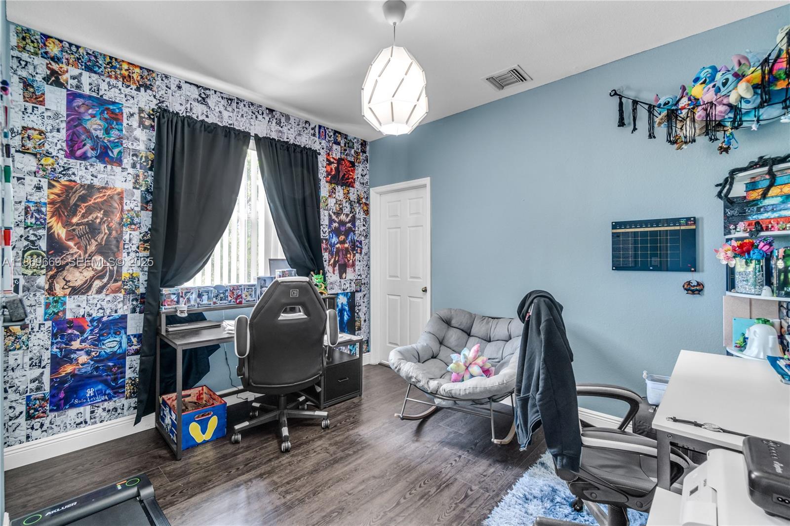 120 Southeast 6th Road Homestead, FL 33030 - Photo 18 of 31 a view of a workspace with furniture and chandelier