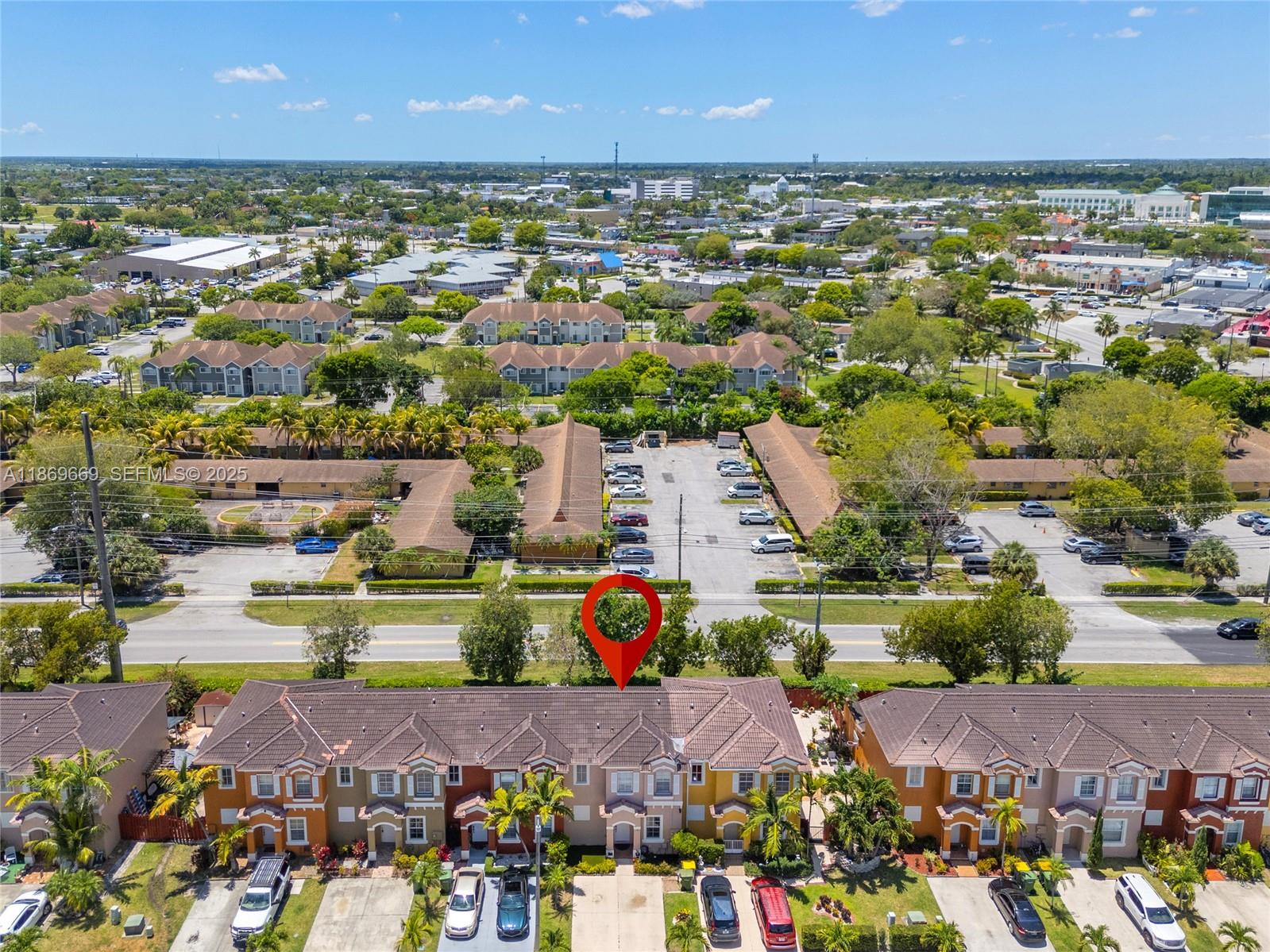 120 Southeast 6th Road Homestead, FL 33030 - Photo 23 of 31 an aerial view of a city with lots of residential buildings ocean and mountain view in back