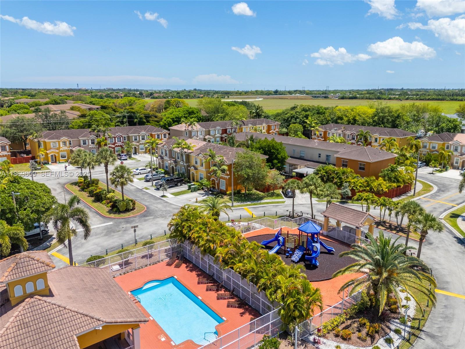 120 Southeast 6th Road Homestead, FL 33030 - Photo 31 of 31 a view of swimming pool with outdoor seating and city in the background