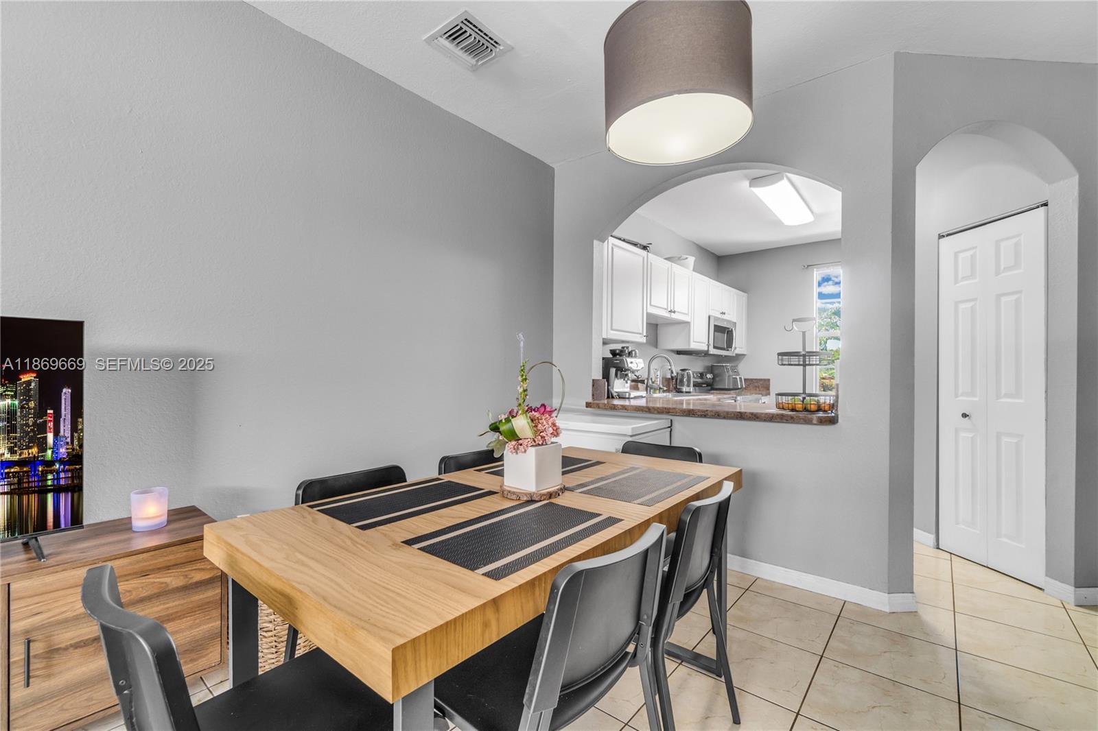 120 Southeast 6th Road Homestead, FL 33030 - Photo 7 of 31 a kitchen with a table and chairs in it