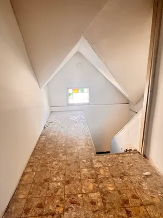 a view of an empty room and window