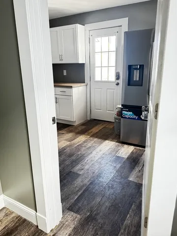 a kitchen with a refrigerator and a stove
