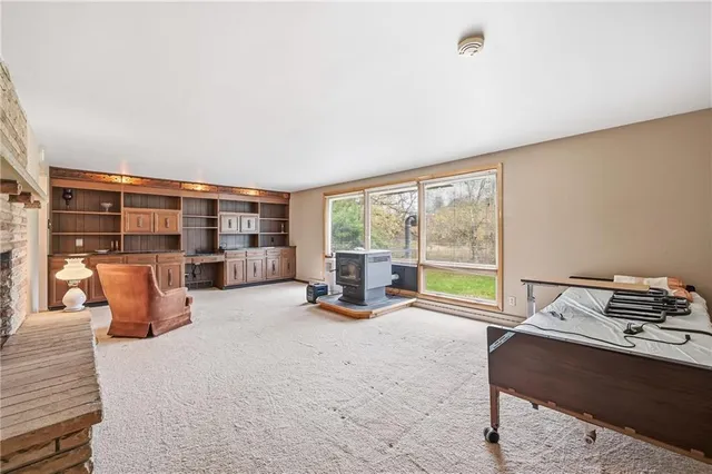 a bed room with a bed and large window