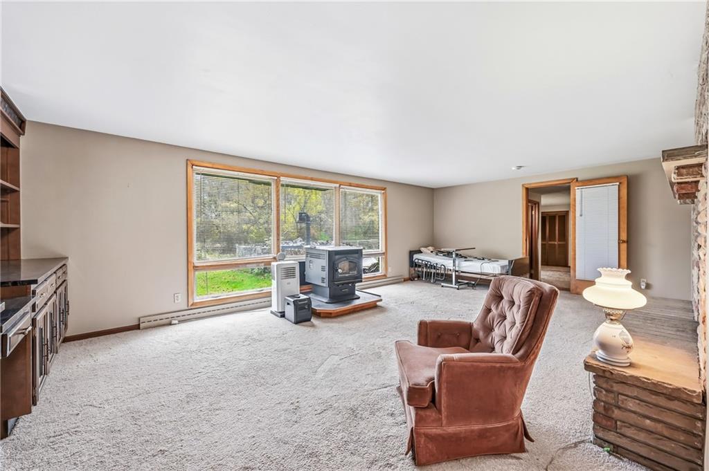 520 South Maysville Road Greenville, PA 16125 - Photo 12 of 33 a living room with furniture and a floor to ceiling window