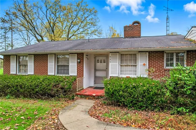 a house view with a garden space
